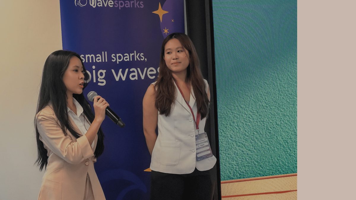 Student team presenting on stage